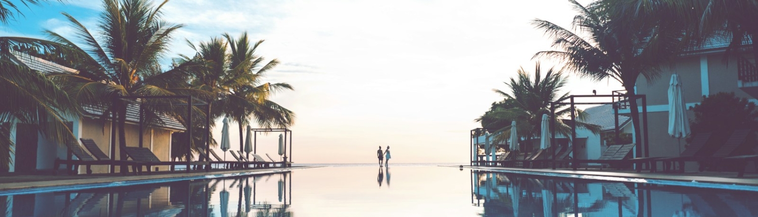 two person standing beside swimming pool