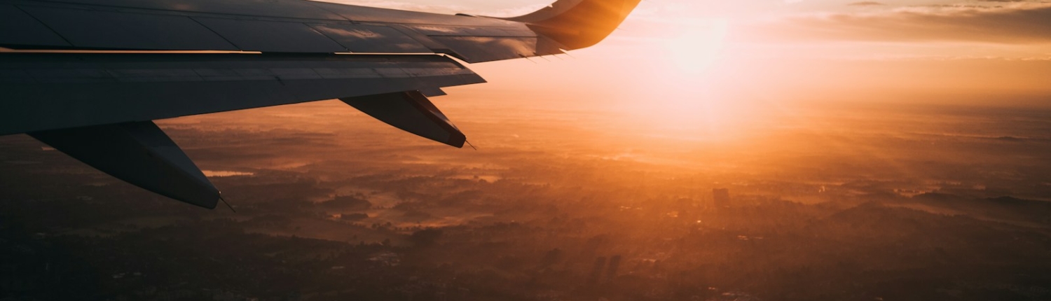 airplane on sky during golden hour