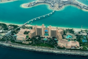 aerial photography of concrete buildings on the middle of the sea